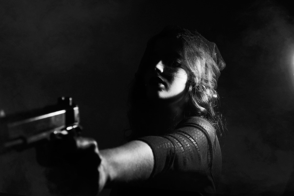 woman holding Pistol Flashlights